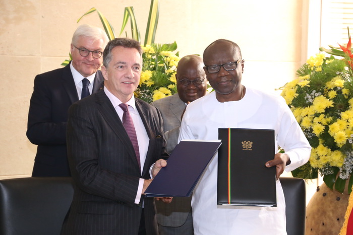 Mr Friedrich Kitschelt, Deputy Minister for Economic Cooperation and Development, exchanging documents with Mr Ken Ofori-Atta after signing a deal between the two countries. 